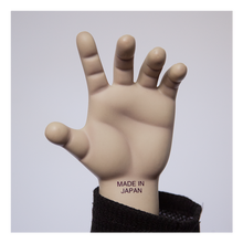 Load image into Gallery viewer, Doll is clothed with black jeans, long sleeve black shirt with short sleeve purple shirt layered over top and black shoes with white side stripes.