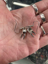 Load image into Gallery viewer, model holding earrings