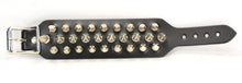 Load image into Gallery viewer, Black leather bracelet with three rows of silver spikes. Top and bottom row consist of 1/2" silver spikes. Center row consists of 1" silver spikes.