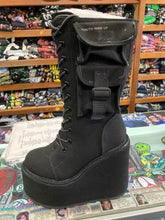 Load image into Gallery viewer, outer side of Women's black canvas mid-calf platform boot. Full lace up front, with full back zipper. Outside of boot has small pocket with strap.