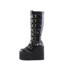 Load image into Gallery viewer, outer side view of black vegan leather 5 1/2" wedge platform Goth punk gogo knee high boot Adjustable straps from top to bottom of boot, with metal plates up the front with full back zipper