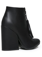 Load image into Gallery viewer, back side of Women's black vegan leather ankle boot with large wedge and front zip with black vegan leather tassel pull.