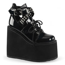 Load image into Gallery viewer, outer side view of black vinyl 5.5" wedge platform Mary Jane style Lace-up front Wrap around style studded adjustable strap around ankle
