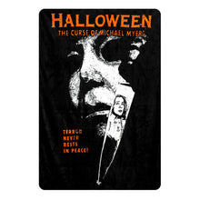 Load image into Gallery viewer, rolled halloween movie poster fleece throw blanket with text that reads "halloween the curse of michael myers. terror never rests in peace"