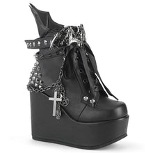 Load image into Gallery viewer, outer view of 5" wedge platform Wedge ankle bootie style boot Features wrap around studded & spike straps Bat buckle detail Chain with various hanging charms Batwing detail up the back Inside metal zip closure.