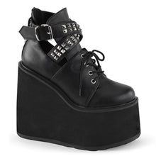 Load image into Gallery viewer, outer side view of black vegan leather 5.5" wedge platform Mary Jane style Lace-up front Wrap around style studded adjustable strap around ankle