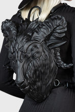 Load image into Gallery viewer, Black leather backpack with goat head design worn by a model
