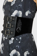 Load image into Gallery viewer, Model wearing a floral pattern dress with black corset-style belt on top
