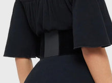 Load image into Gallery viewer, Model wearing a black dress with black corset-style belt on top
