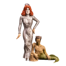 Load image into Gallery viewer, Two figurines, one in a silver dress and the other in a mermaid costume, on a white background

