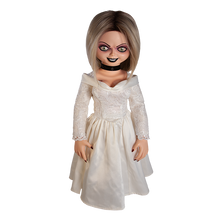 Load image into Gallery viewer, Doll is clothed with a white long sleeve wedding dress and black choker accessory. Has tattoo on right breast of a red heart with a dagger stabbed in it and the text &quot;chucky&quot; above the heart.
