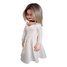 Load image into Gallery viewer, Doll is clothed with a white long sleeve wedding dress and black choker accessory. Has tattoo on right breast of a red heart with a dagger stabbed in it and the text &quot;chucky&quot; above the heart.
