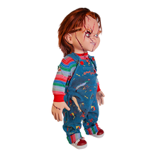 Load image into Gallery viewer, Doll is clothed with good guy overalls, long sleeve shirt and red sneakers. Doll has two black eyes and scars/stitches along face
