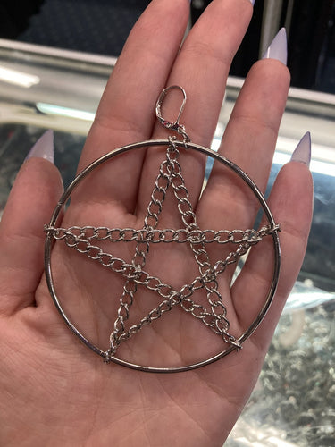 model holding earring