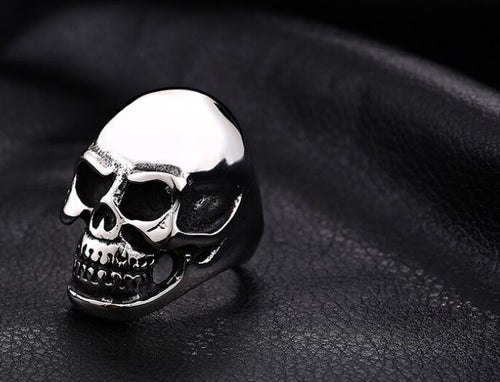 silver colored skull head ring