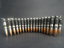 Load image into Gallery viewer, .308 nickel plated bullet belt with copper plated tips and black links
