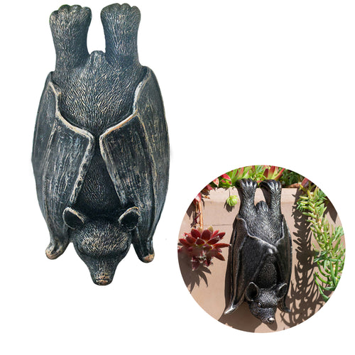 Upside down gray resin hanging bat statue.