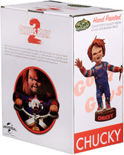 Load image into Gallery viewer, box of Head knocker bobble head of Chucky from Child&#39;s Play 2. Chucky has his right hand up, mouth open as if he is yelling, and in his left hand is clutching a knife. Chucky stands on a small round platform that reads &quot;CHUCKY&quot; in red letters on the front.
