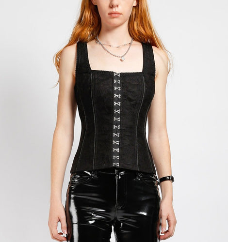 front of Black corset top with hook eye closure in the front, and adjustable lace up back. Corset has a flower overlay pattern on front and back.