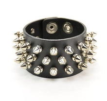 Load image into Gallery viewer, black leather bracelet with three rows of multiple silver spikes. shows snap closure
