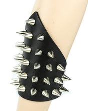 Load image into Gallery viewer, Triangular small black leather gauntlet bracelet with silver cone spikes.
