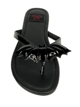 Load image into Gallery viewer, top of Black flat sandal with vegan leather patent bat on top.  Vegan leather with black rubber outsole.
