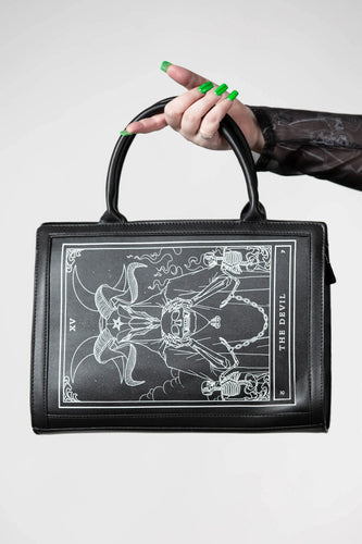 model holding purse
