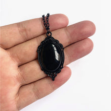 Load image into Gallery viewer, model holding necklace
