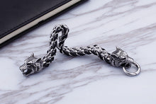Load image into Gallery viewer, Black/Silver Colored Woven Double Wolf Head Bracelet
