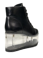 Load image into Gallery viewer, back view of black vegan leather platform shoe with clear plastic platform. Shoe looks like a sneaker, but is super tall! Clear plastic bottom has a Velcro foot bed opening, to insert toys, candy or fun stuff into the clear bottom of the shoe.

