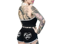 Load image into Gallery viewer, women&#39;s Black shorts with white trim and white heart designs on both buttcheeks. left heart says &quot;fuck off&quot; and right heart says &quot;fuck you.&quot; with white drawstring
