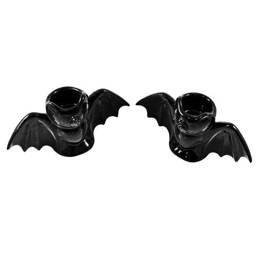 Black bat candlestick holders come in a set of two, and each holds a standard taper candle. CANDLES NOT INCLUDED.