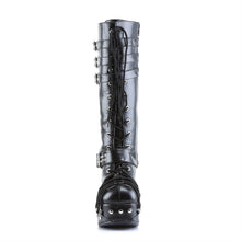 Load image into Gallery viewer, front side view of black vegan leather 2 inch platform knee high boot with three adjustable side buckles near the top, adjustable buckle around base, and lace details on front, platform, and heel of boot with lace-up front
