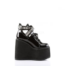 Load image into Gallery viewer, outer side view of black vinyl 5.5&quot; wedge platform Mary Jane style Lace-up front Wrap around style studded adjustable strap around ankle
