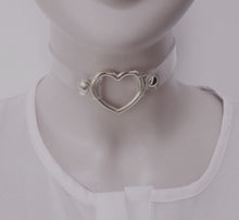 Load image into Gallery viewer, front view of Clear pvc choker with Metal heart at front center and Adjustable buckle closure on back
