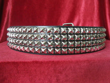 Load image into Gallery viewer, wide width black leather belt with four rows of silver pyramid studs. shows silver adjustable buckle
