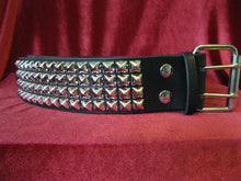 Load image into Gallery viewer, wide width black leather belt with four rows of silver pyramid studs. shows silver adjustable buckle
