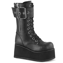 Load image into Gallery viewer, outer view of Black vegan leather vinyl 3 1/2&quot; platform lace-up mid-calf boot with ornamental inner and outer zipper details, oversized buckle strap and back zip closure.
