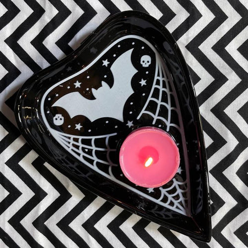 Use as a place to stash jewelry, coins, or other small things. Planchette is black, with a white bat, small white skull and stars details,, and white spiderweb details. CANDLE NOT INCLUDED.