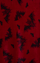 Load image into Gallery viewer, burgundy fleece blanket with black trim, featuring a black bats pattern.
