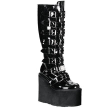 Load image into Gallery viewer, outer side view of black vinyl 5 1/2&quot; wedge platform Goth punk gogo knee high boot Adjustable straps from top to bottom of boot, with metal plates up the front with full back zipper
