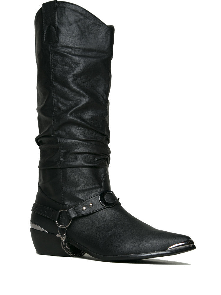 outer side of Women's black vegan leather cowboy boot with attached bootstrap made out of black vegan leather and gunmetal hardware. Bootstrap has O ring on the outer side, detachable chain underneath, and gunmetal crescent moon on front.